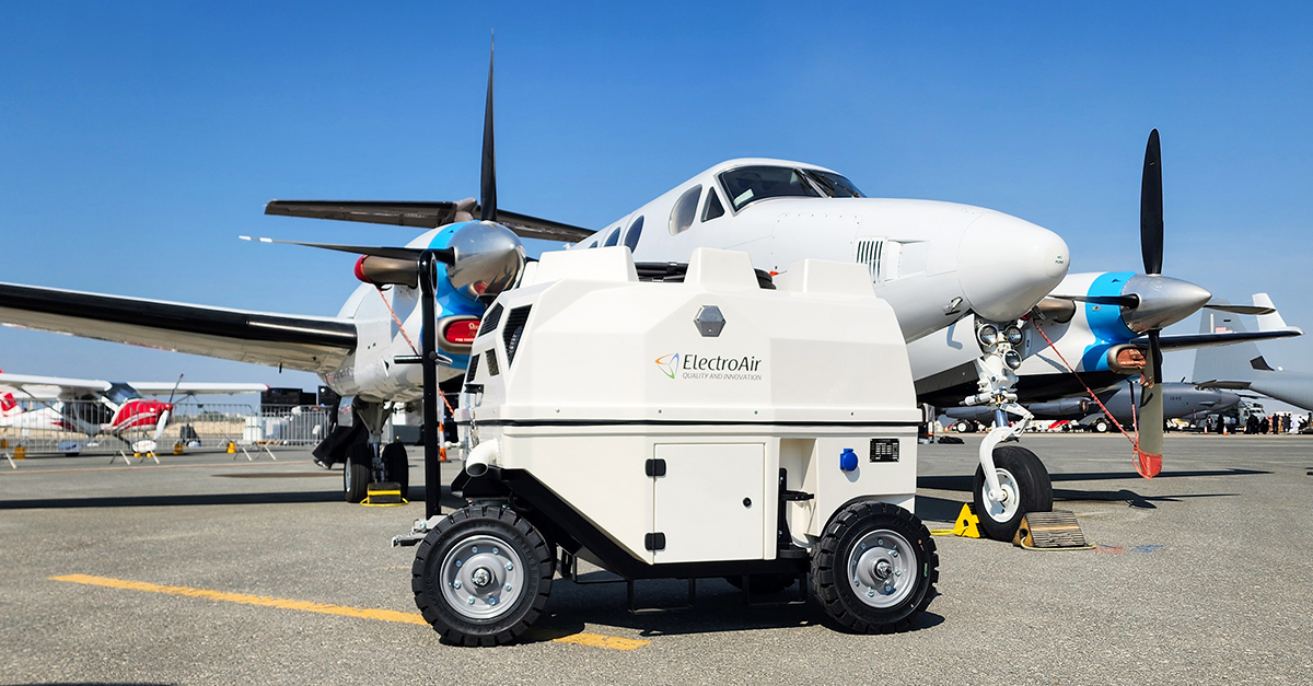 ElectroAir diesel Ground Power Unit (GPU) supplying 400 Hz power to a twin-engine aircraft on the apron