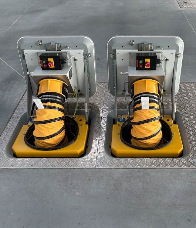 Two ElectroAir underground PIT systems on an airport apron, providing 400Hz aircraft ground power connection points with protected cable reels.